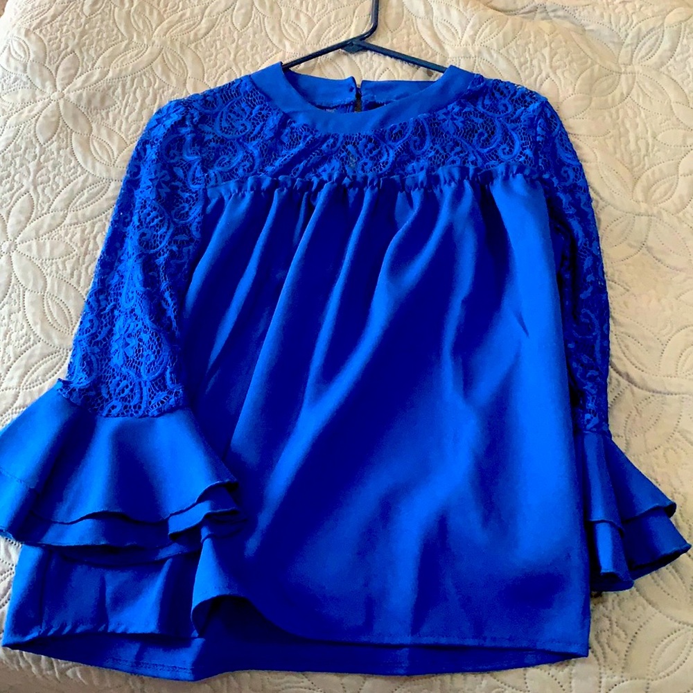 Large but fits like a medium. Royal blue
